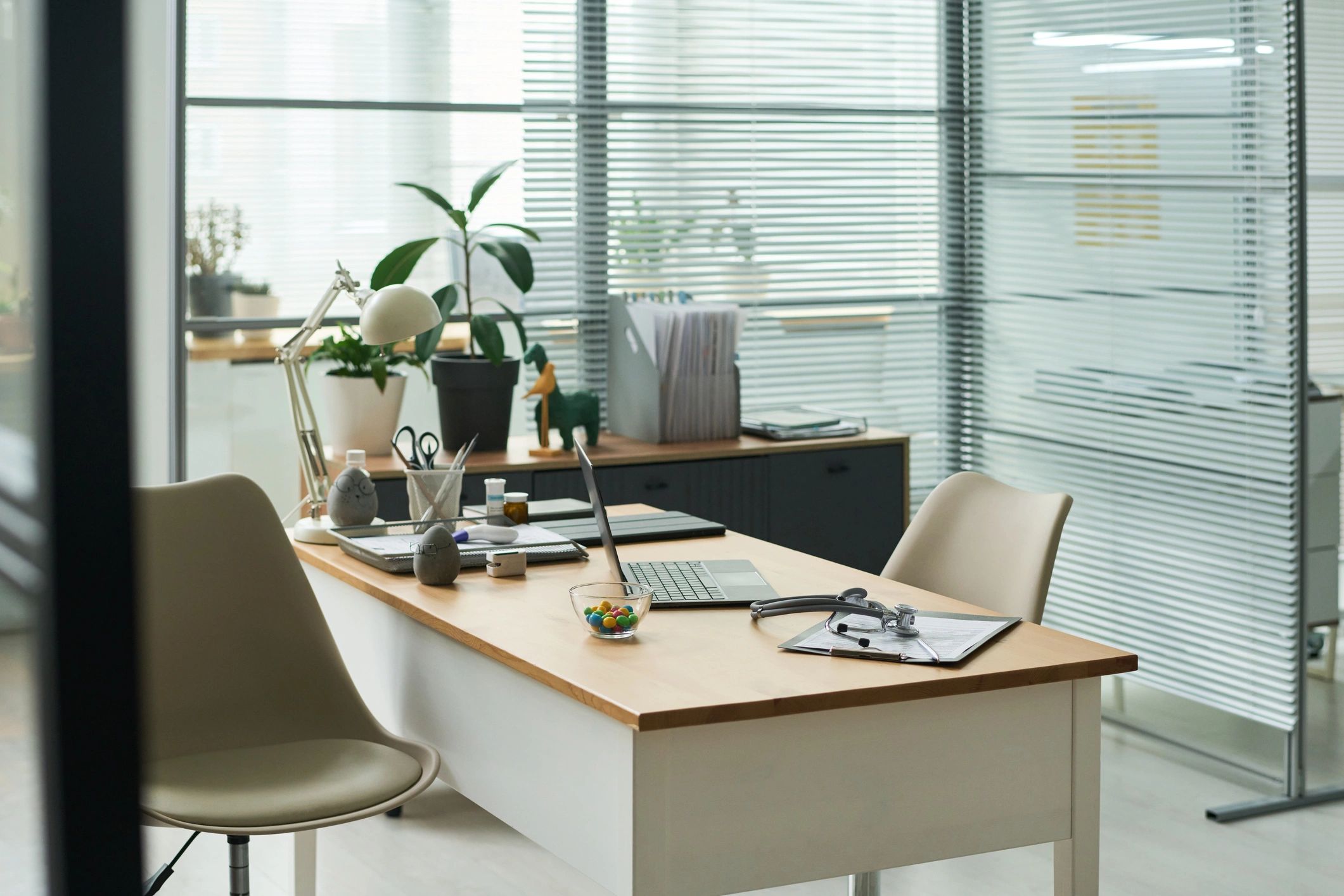 Professional consultation workspace with laptop and documents